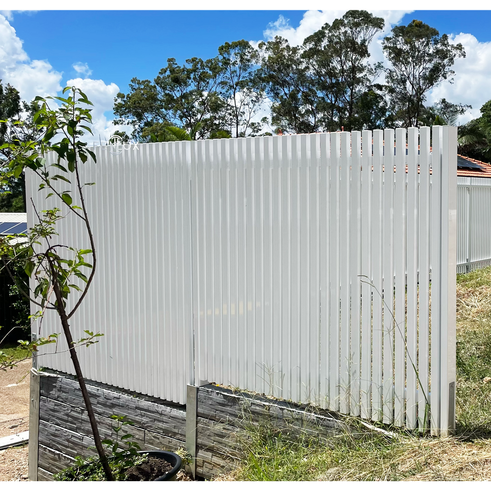 batten fence on retaining wall