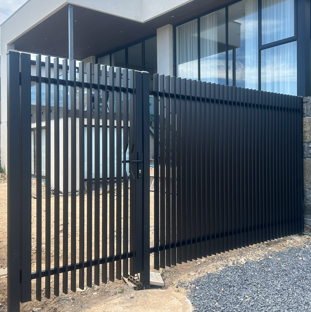 Morden house with welded blade style pedestrian gate